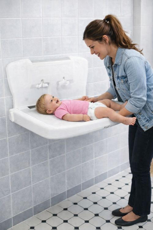 Table à langer horizontale avec distributeur d'alèses